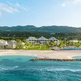 A beach with hotel and a body of water